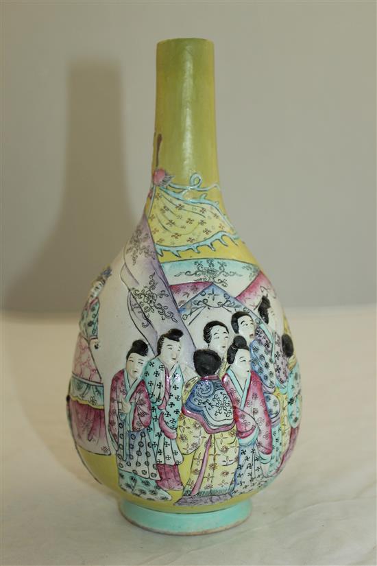 A Chinese moulded and enamelled biscuit porcelain bottle vase, Qianlong seal mark, 19th century, 22.5cm, neck restored